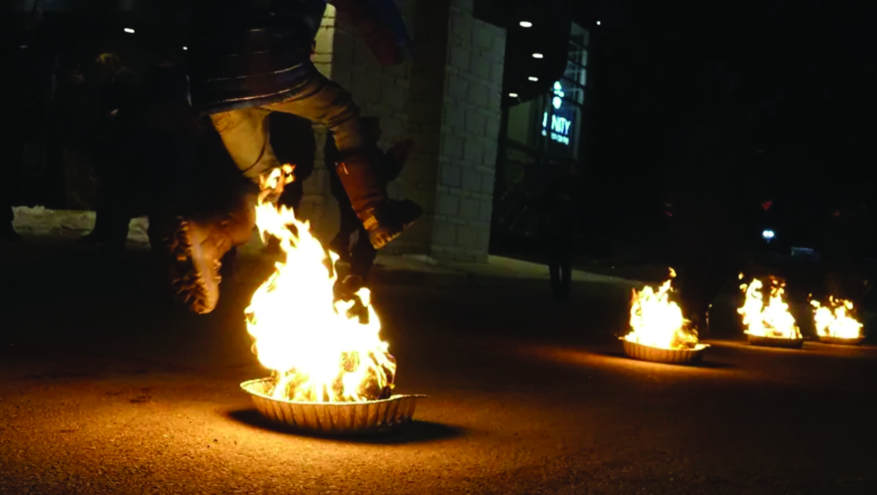 A fire-jumper celebrates Nowruz, the Persian New Year, in Ottawa. (CBC)